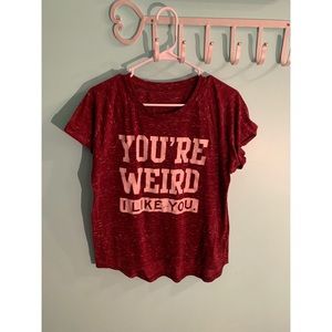 Maroon T-shirt// text: you’re weird, I like you